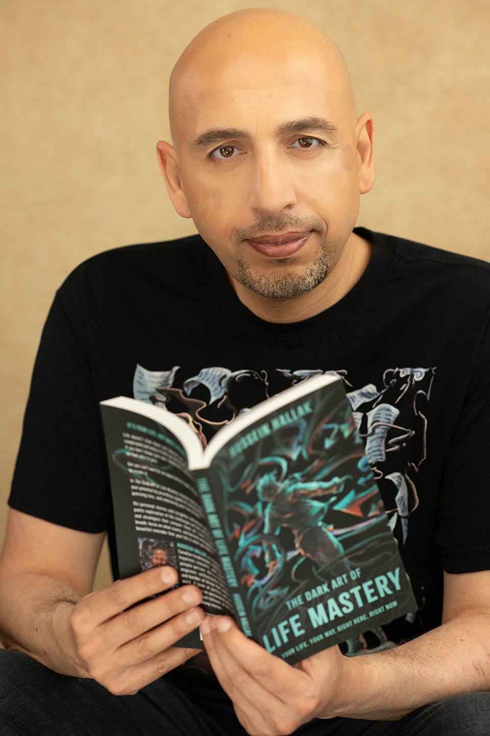 Hussein Hallak reading The Dark Art of Life Mastery